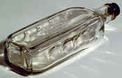 Watkins perfume bottle with finger grips